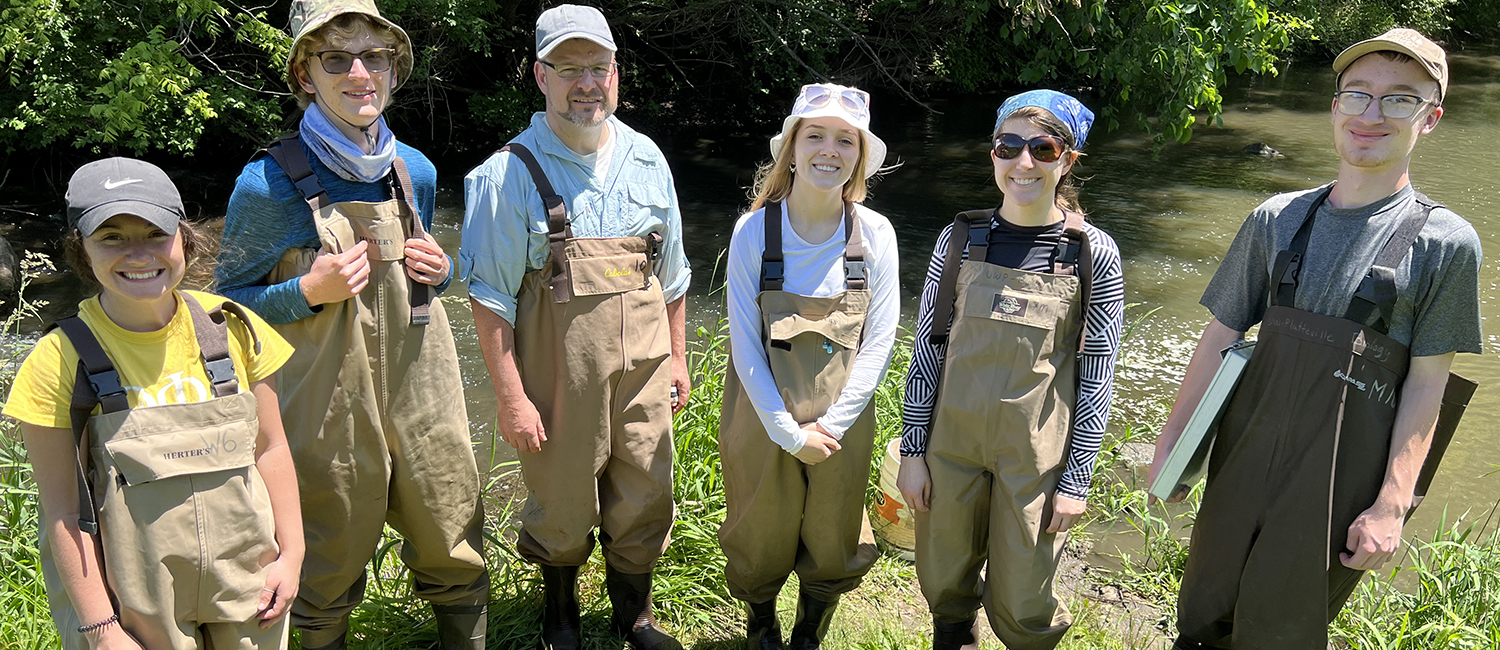 Student and faculty identifying mussels