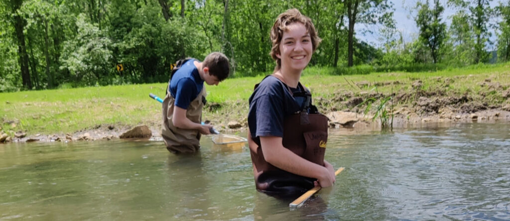 Students in river for Red Cedar Basin project